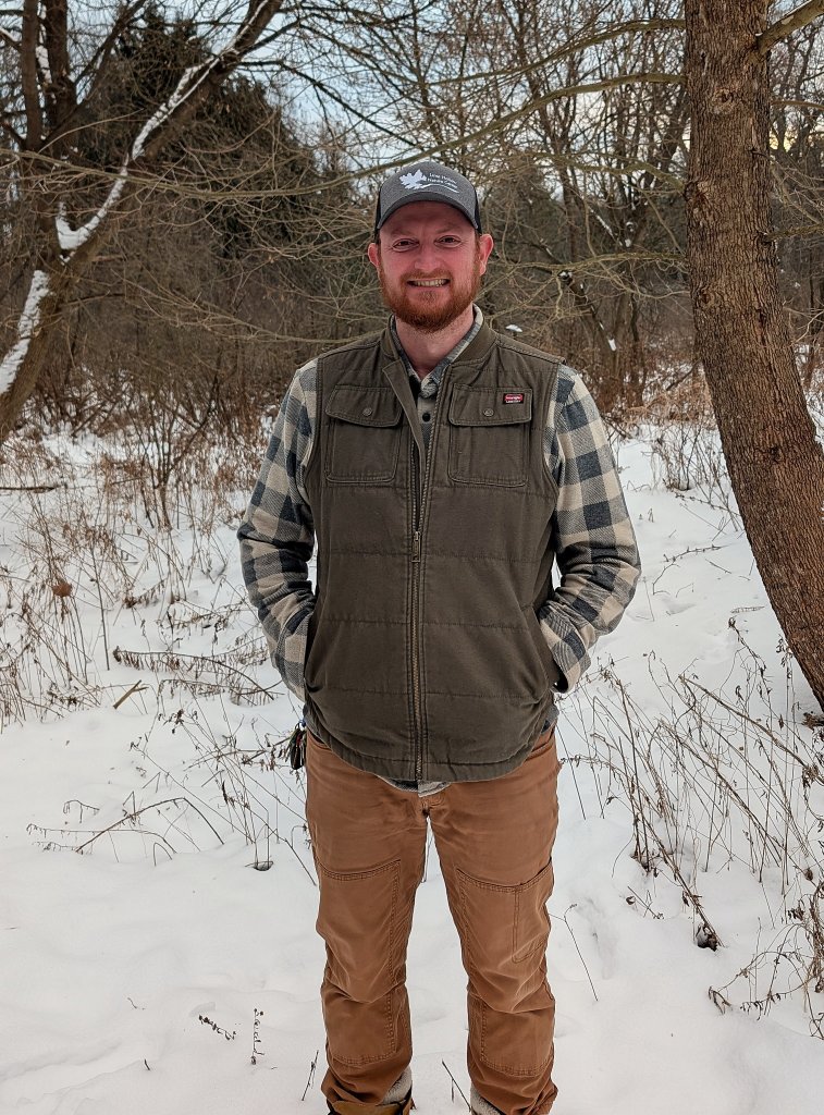 Find Hidden Gems of the Finger Lakes Region - Walk, Ride, or Sit and Enjoy the View a man standing in the snow
