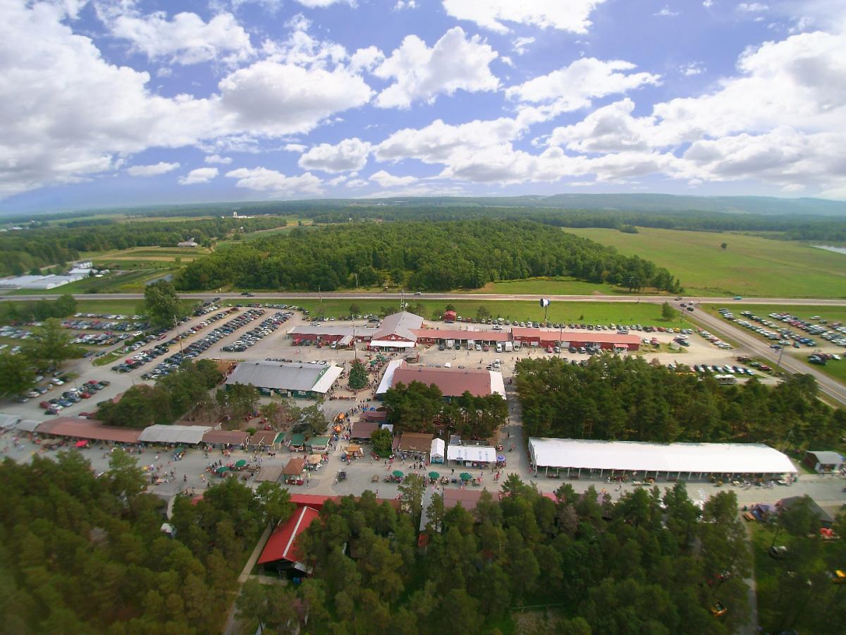 Take a “Traditional” Approach to Your Next Finger Lakes Vacation aerial view of a parking lot with many buildings and trees